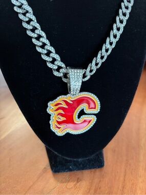 Iced Out Calgary Flames pendant with Silver tone chain